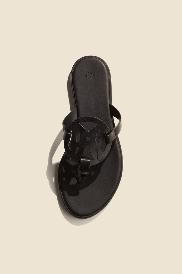 H&M Zehensandalen mit Monogramm Schwarz