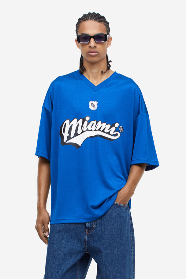 H&M Oversized T-Shirt aus Mesh mit Print Blau/Miami