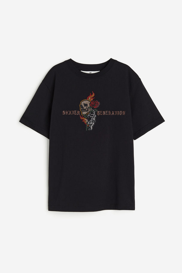 H&M Bedrucktes T-Shirt aus Jersey. Schwarz/Skater Generation