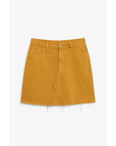 Denim mini skirt Must-have mustard