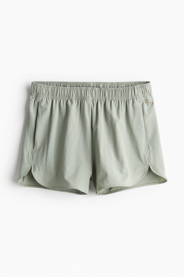 H&M DryMove™ Sportshorts Helles Khakigrün