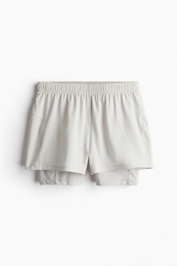 H&M DryMove™ Zweilagige Laufshorts Hellbeige