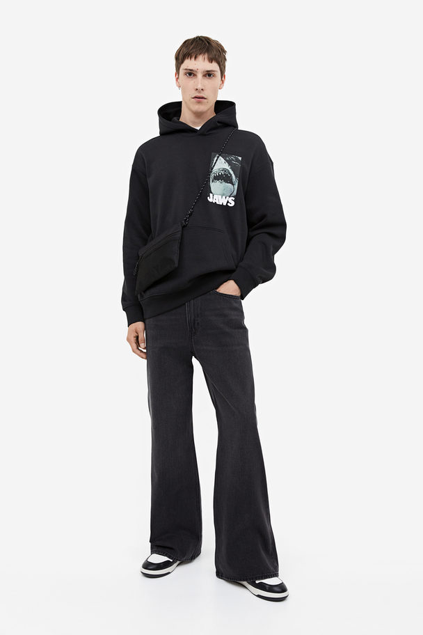 H&M Hoodie Relaxed Fit Schwarz/Jaws