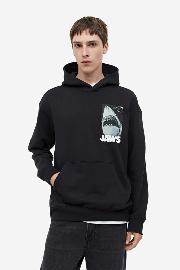 H&M Hoodie Relaxed Fit Schwarz/Jaws