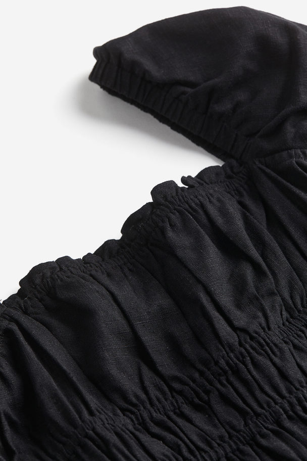 H&M Kleid mit gesmokter Taille aus Leinemix Schwarz