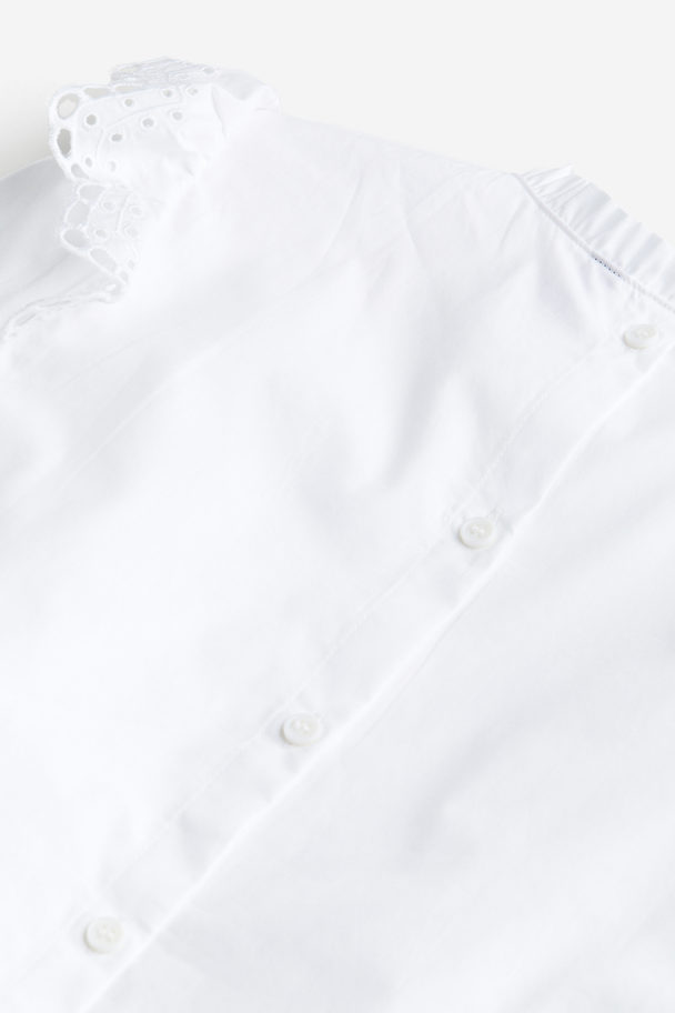 H&M Volantbluse mit Detail in Broderie Anglaise Weiß