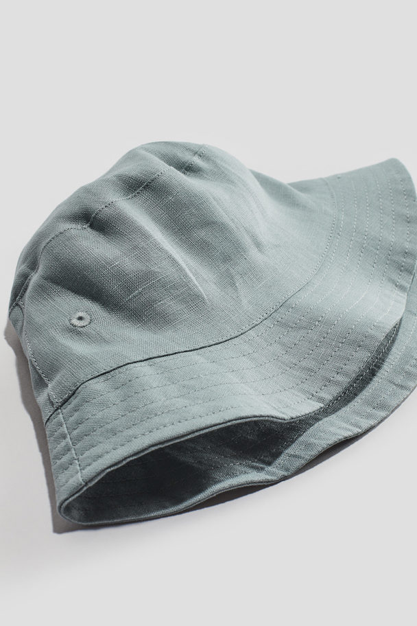 H&M Bucket Hat aus Leinen Helles Matttürkis