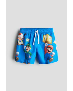 Badeshorts mit Print Knallblau/Super Mario