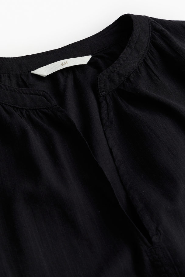 H&M Bluse mit Kappenärmeln Schwarz