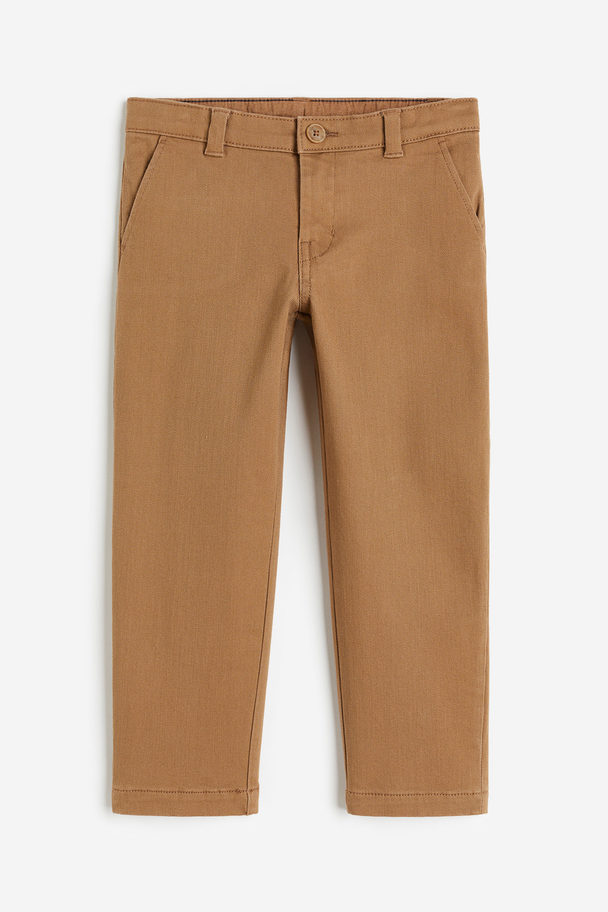 H&M Chino aus Twill in Relaxed Fit Dunkelbeige