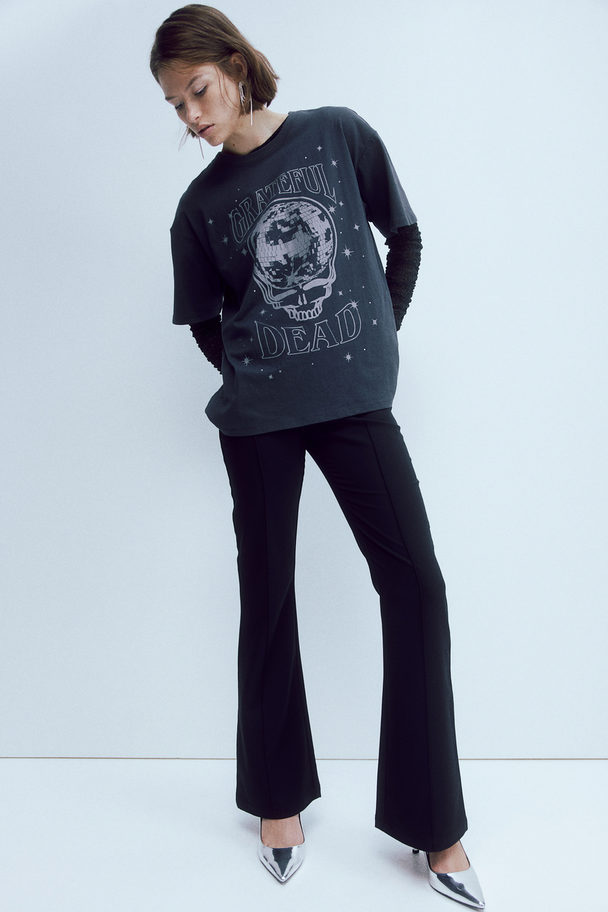 H&M Elegante ausgestellte Hose Schwarz