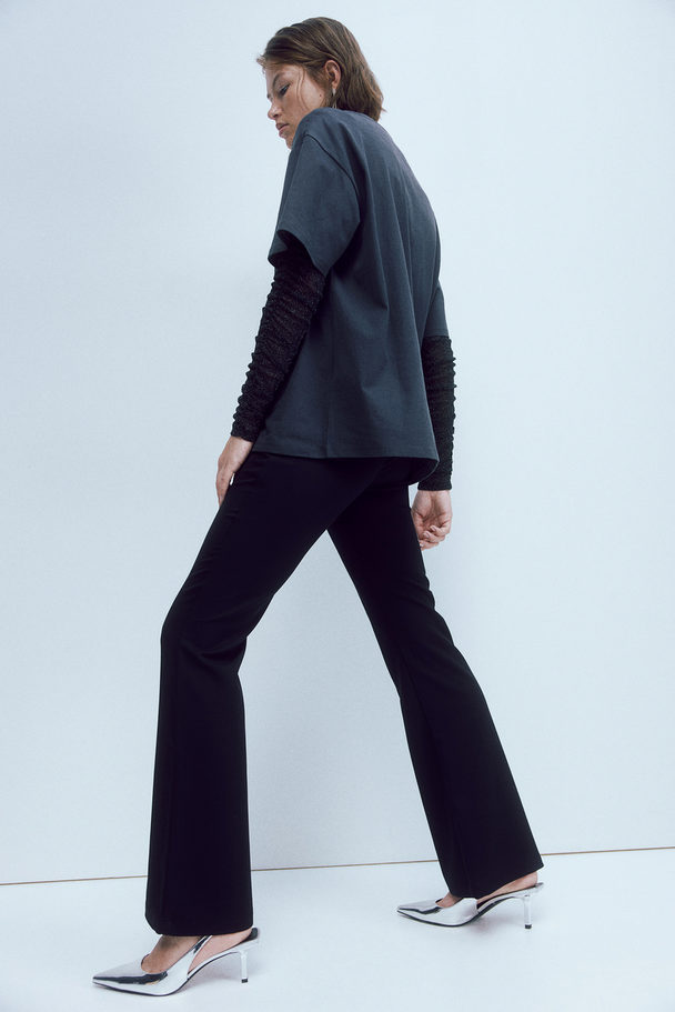 H&M Elegante ausgestellte Hose Schwarz