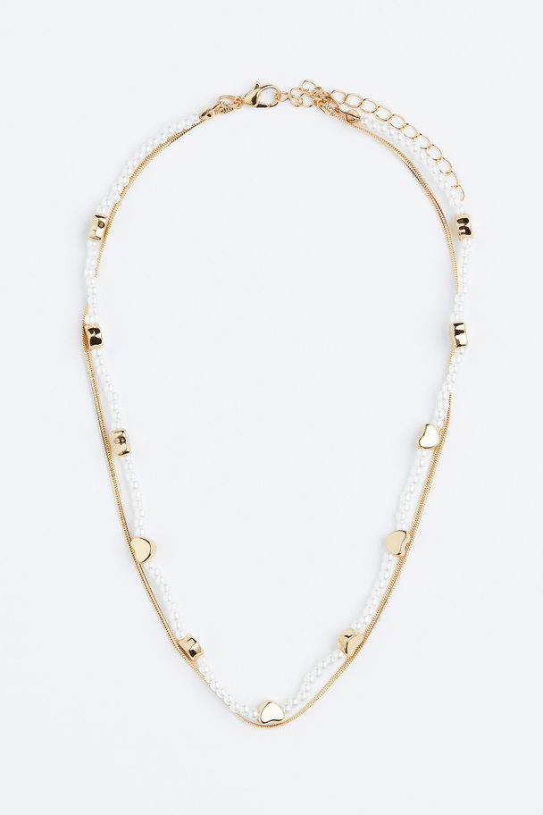 H&M Zweireihige Kette mit Perlen Goldfarben/Herzen