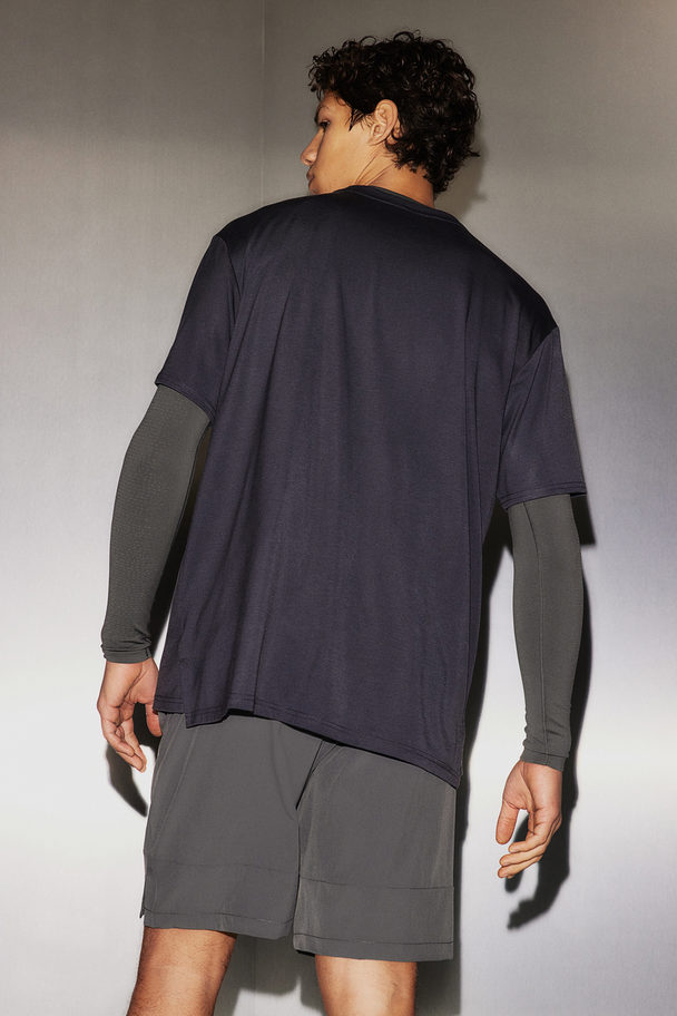 H&M DryMove™ Sport-T-Shirt in Loose Fit Stahlblau