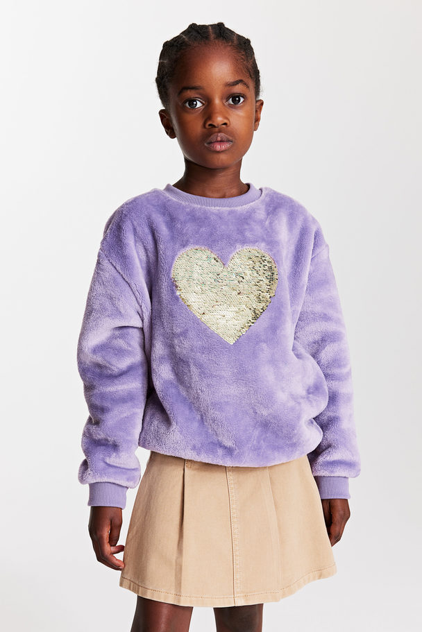 H&M Sweatshirt mit einem Motiv aus Wendepailletten Lila/Herz