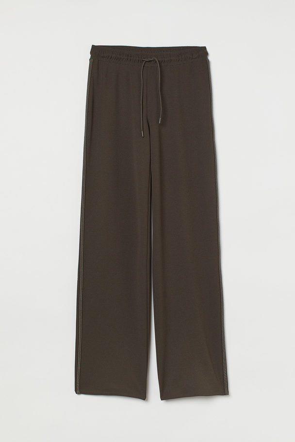 H&M Weite Hose mit Seitenstreifen Dunkles Khakigrün
