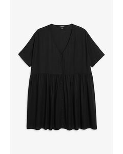 Babydoll-Kleid mit V-Ausschnitt Schwarz
