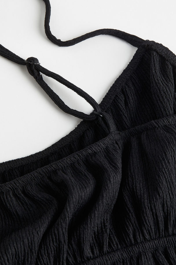 H&M Kurzer Jumpsuit aus gecrinkeltem Jersey Schwarz