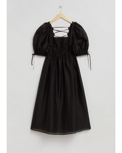 Babydoll-Kleid mit Bindedetails an den Ärmeln Schwarz