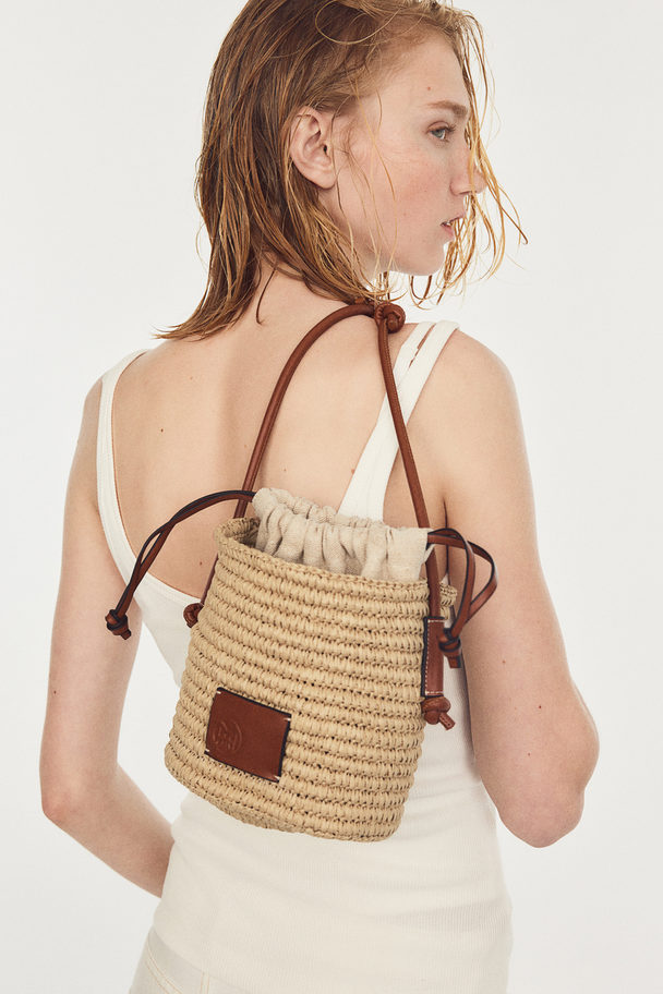 H&M Bucketbag Van Stro Beige