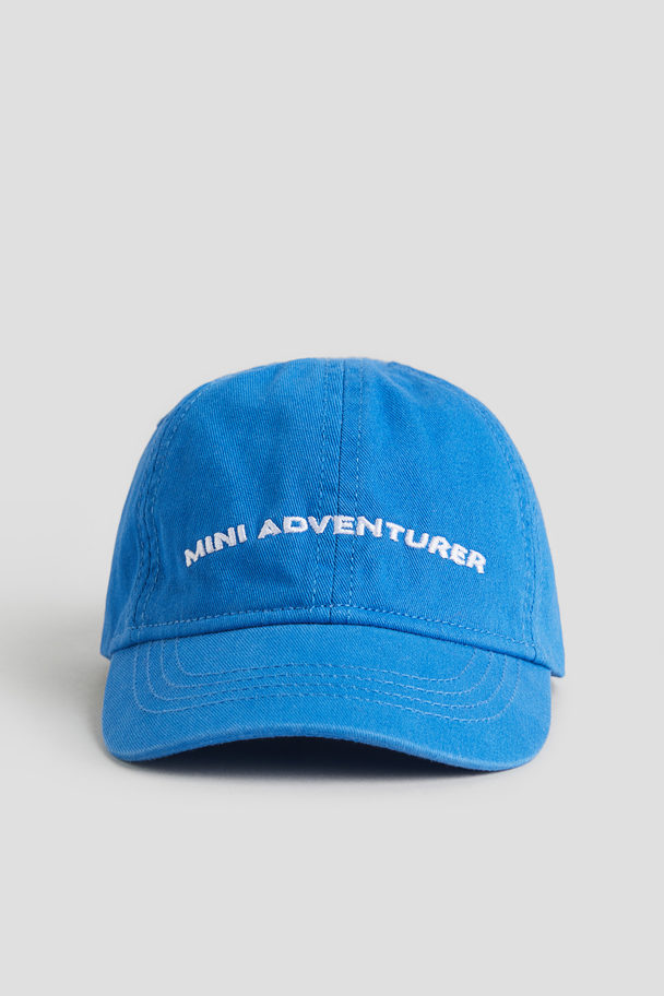 H&M Baumwollcap Blau/Mini Adventurer