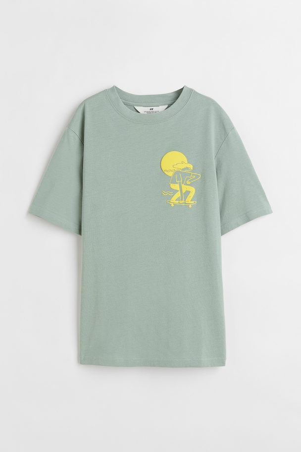 H&M T-Shirt aus Baumwolle Hellgrün/Skater