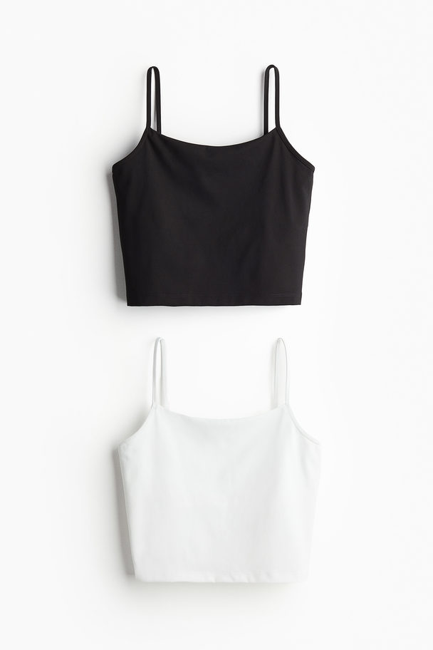 H&M 2er-Pack Sporttops mit integriertem BH Schwarz/Weiß