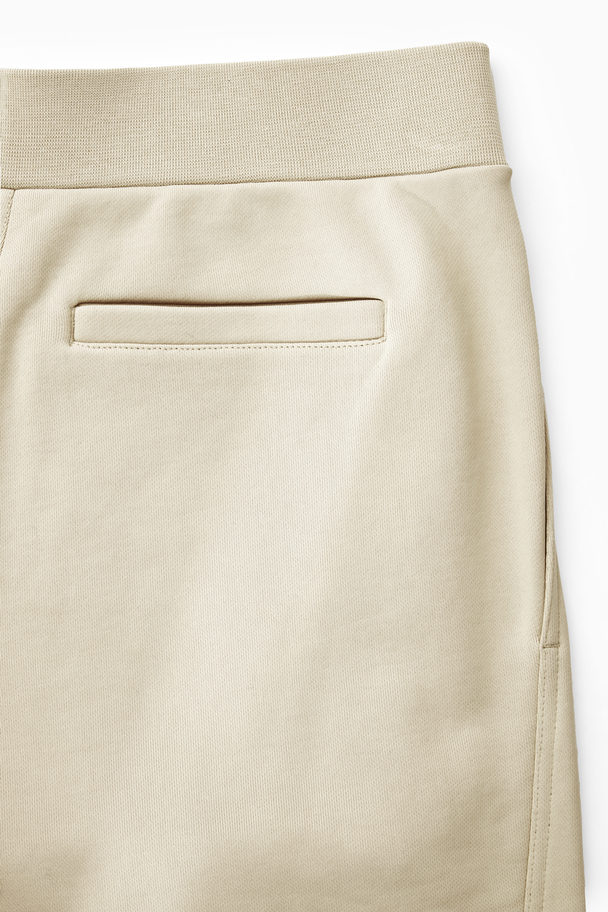 COS Exposed-seam Jersey Sweatpants Light Beige