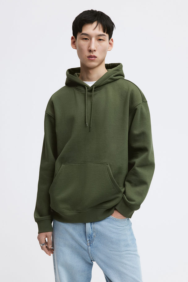 H&M Capuchonsweater - Loose Fit Donkergroen