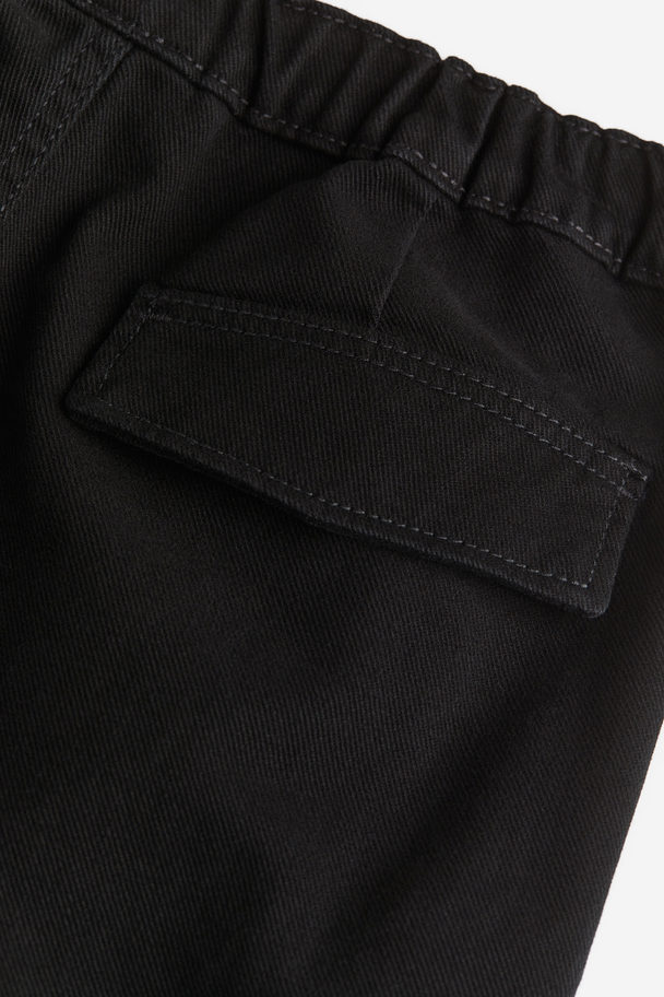 H&M Denim-Joggpants im Fallschirmschnitt Schwarz
