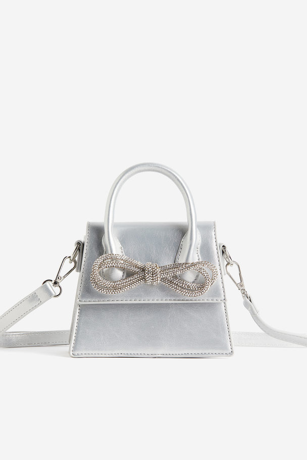 Public Desire The Indy Silver Diamante Bow Mini Bag Silver Pearlescent