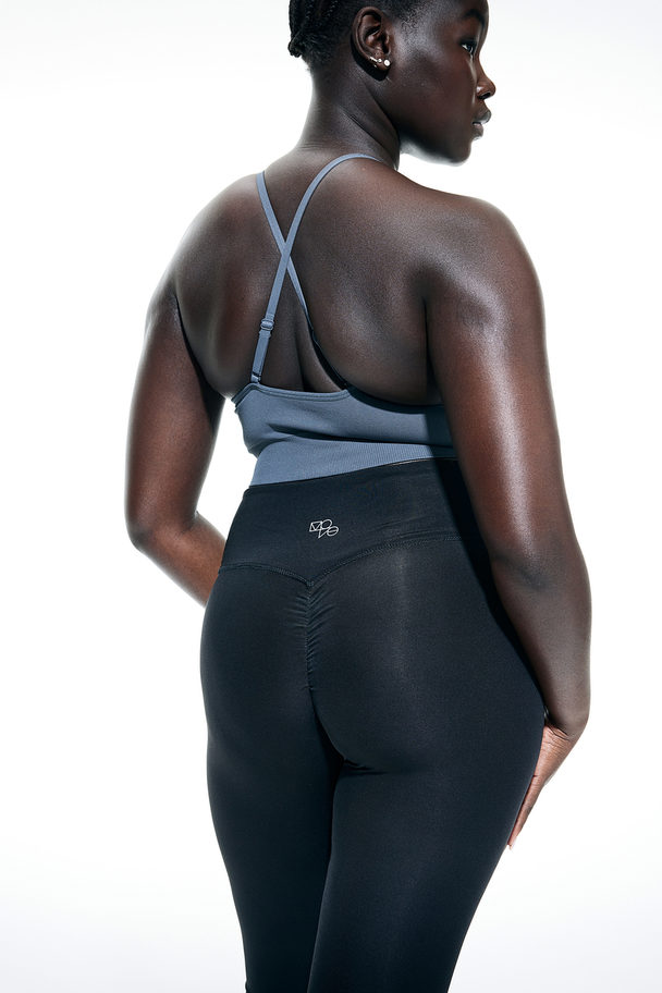 H&M DryMove™ Sportleggings mit überlappendem Bund Schwarz