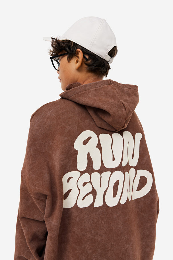 H&M DryMove™ Sport-Hoodie in Oversize Dunkelbraunmeliert/Run Beyond