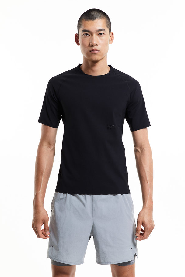 H&M DryMove™ Sport-T-Shirt mit Print Schwarz