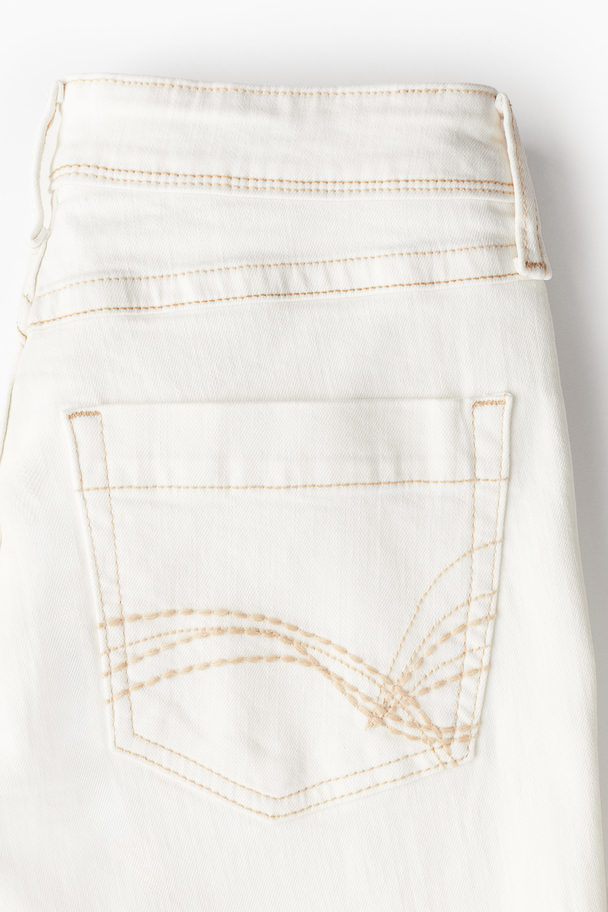 H&M Flared Low Jeans Cremefarben