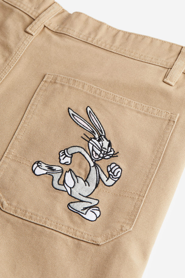 H&M Workerhose Relaxed Fit Beige/Looney Tunes