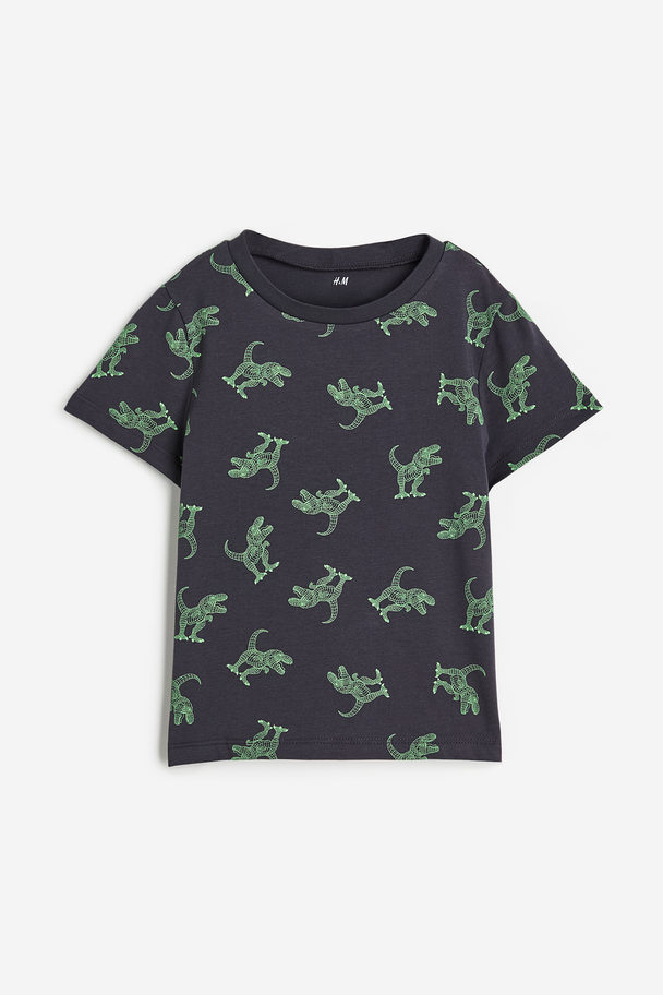 H&M T-Shirt aus Baumwolle Schwarz/Dinosaurier