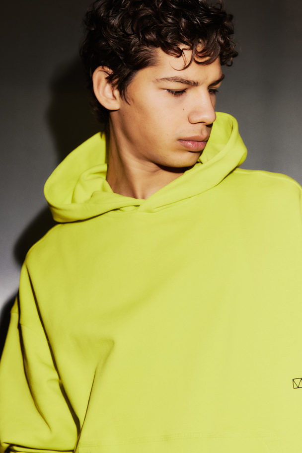 H&M Träningshuvtröja I Drymove™ Loose Fit Neongrön