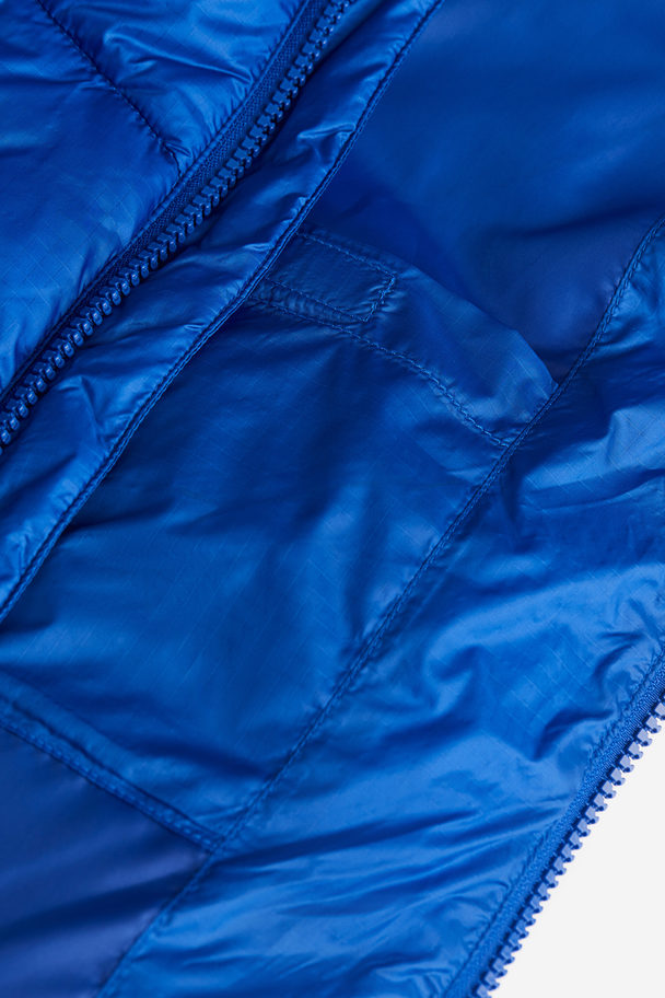 H&M Waterafstotend Pufferjack - Loose Fit Helderblauw