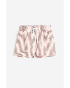 Gemusterte Badeshorts Mattorange/Gestreift