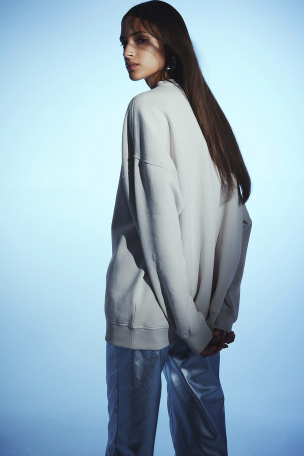 H&M Oversized Sweatshirt mit Motiv Hellbeige/Digital