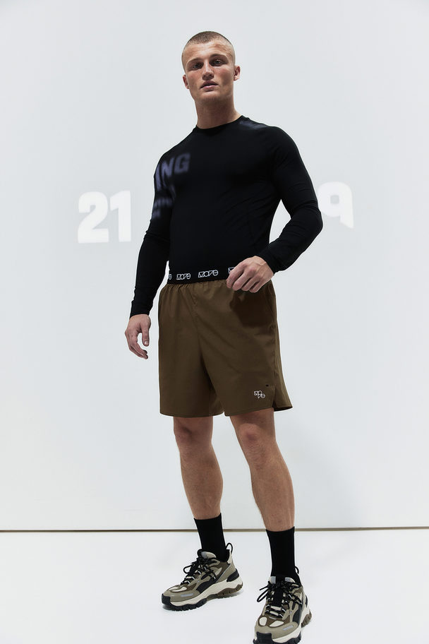 H&M Drymove™ 2-in-1 Sports Shorts In 4-way Stretch  Dark Khaki Green