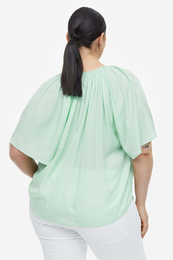 H&M Bluse in Oversize-Passform Hellgrün
