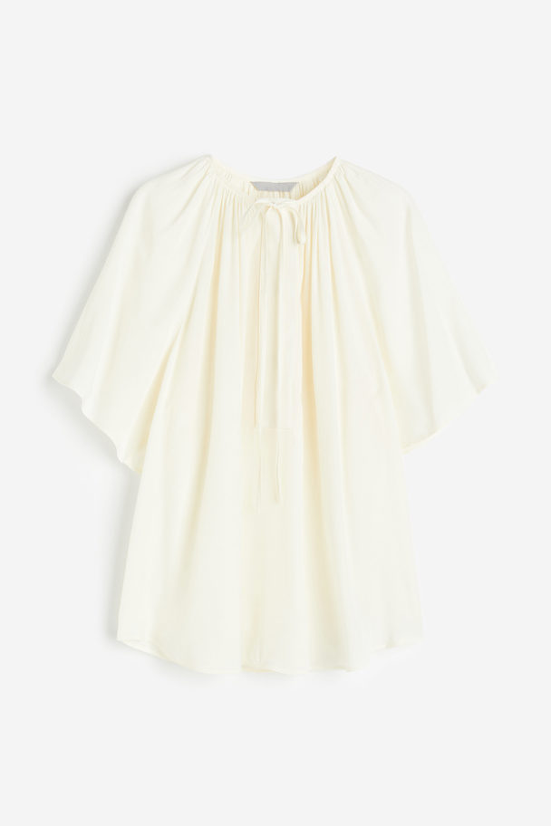 H&M Bluse in Oversize-Passform Cremefarben