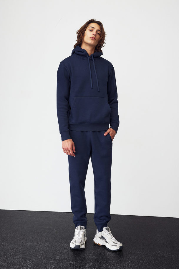 H&M DryMove™ Sport-Hoodie in Regular Fit Marineblau