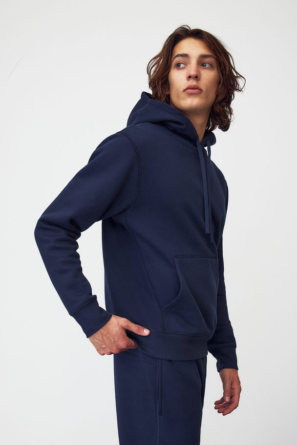 H&M DryMove™ Sport-Hoodie in Regular Fit Marineblau