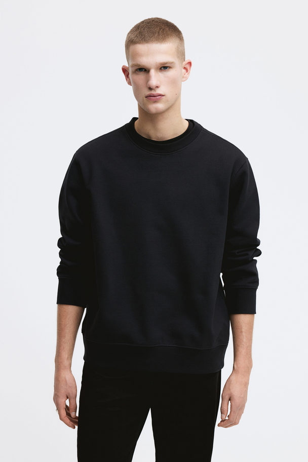 H&M Sweatshirt in Regular Fit Schwarz