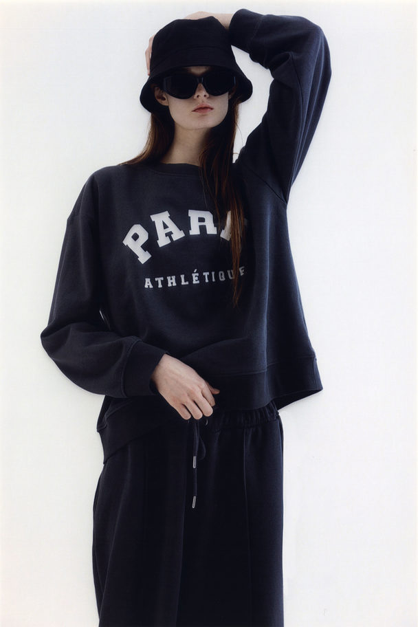H&M Sweatshirt mit Print Dunkelgrau/Paris