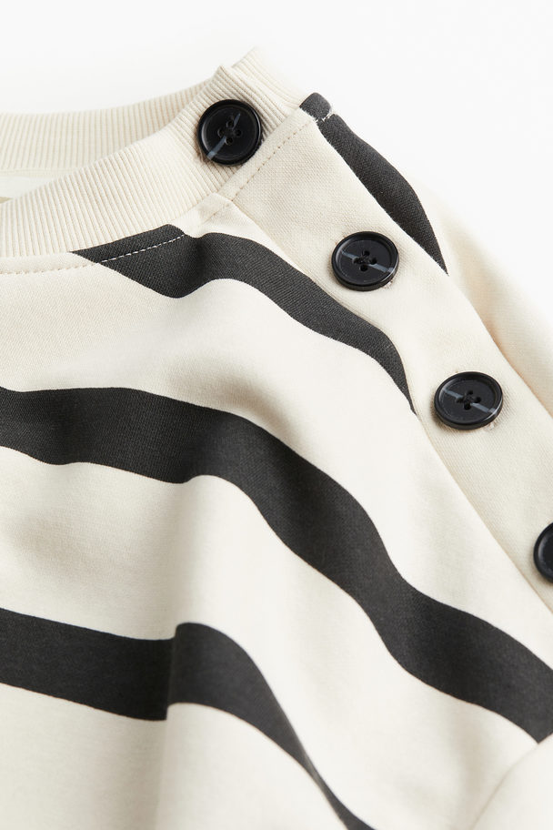 H&M Sweatshirt mit Knopfdetail Cremefarben/Schwarz gestreift