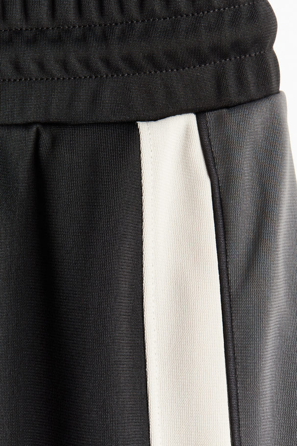 H&M Trainingshose mit seitlichen Streifen Schwarz